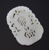 A Chinese celadon white jade plaque, 19th century, carved and pierced with a shou character and