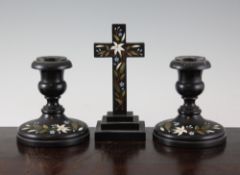 A pair of 19th century Derbyshire black marble dwarf candlesticks, with circular bases inlaid with