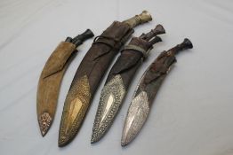 A Nepalese kukri, the leather scabbard with silver mounts, together with three other Nepalese