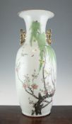 A Chinese famille rose vase, 20th century, painted with yellow birds perched in blossoming