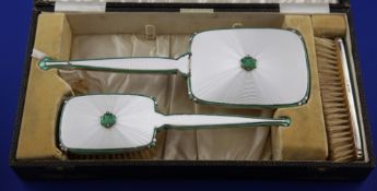 A 1930`s Art Deco three piece silver and two colour enamel brush set, comprising mirror and two