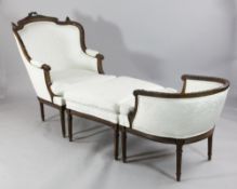 A Louis XVI design carved beech framed three section Duchesse brise, upholstered in a pale cream
