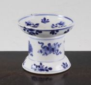 A Chinese export blue and white pounce pot, Kangxi period, the capstan shaped body painted with