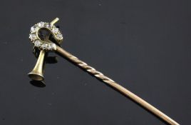 A late Victorian gold and diamond hunting related stock pin, with crossed hunting horn and diamond