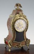 An early 20th century French red boulle work mantel clock, with eagle surmount and movement