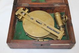 A Troughton brass surveyor`s compass, the dial marked Troughton, London within a fitted case, 10in.