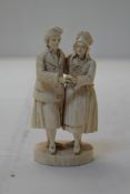 A late 19th century Dieppe ivory carved group of a couple dancing, 4.5in.