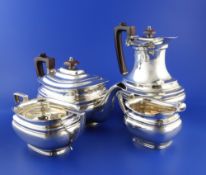 A George VI silver four piece tea set, of rounded rectangular form, with banded girdle, Roberts &