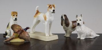 Four Royal Worcester figures of dogs and a similar menu holder, the first a `Terrier` modelled by