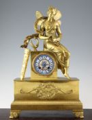 A 19th century French Empire style ormolu mantel clock, mounted with a figure of Psyche opening a