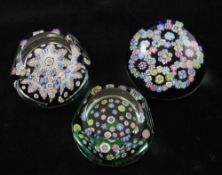 Three Whitefriars millefleur glass paperweights, two of pentagonal form with circular facets, with