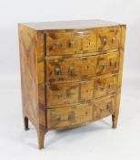 A 19th century Italian walnut four drawer chest, with parquetry veneers and swing brass handles, W.