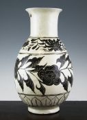 A Chinese Cizhou pottery vase, possibly Ming Dynasty, decorated in brown slip and sgraffito with