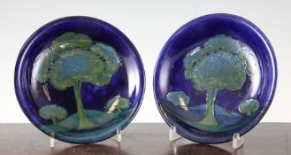 A pair of Moorcroft Moonlit Blue circular dishes, c.1928, inscribed WM monogram, impressed mark