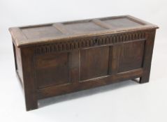 An 18th century oak coffer, with triple panelled front, W.4ft 2in.
