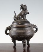 A Chinese or Japanese bronze censer and cover, 18th/19th century, of compressed globular form cast