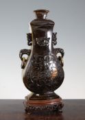 A large Chinese tiger`s eye archaistic vase and cover, mid 20th century, carved in relief with