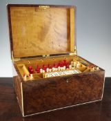 A 1930`s Alfred Dunhill games compendium, the amboyna case with ivory stringing, the lid opening