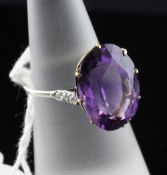 A white gold, amethyst and diamond ring, of oval form, with yellow gold setting and diamond set