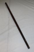 A Victorian mahogany telescope gadget cane, the handle and pommel unscrewing to reveal a brass