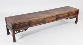 A Chinese rectangular low table, fitted with five frieze drawers, with scrolling pierced corner