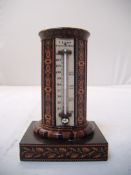 A 19th century Tunbridgeware octagonal desk thermometer and compass, the ivory thermometer gauge