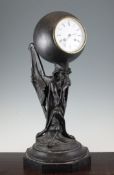 A 19th century French spelter mantel clock, modelled with a figure of a seated Mephistopheles, on