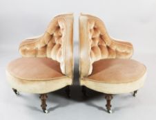 A Victorian walnut four piece conversation seat, with peach buttoned fabric, on tapering turned legs