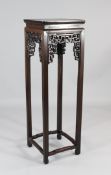 A tall Chinese rosewood urn stand, with square top above typical pierced brackets, with square