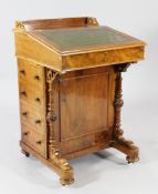 A late Victorian walnut davenport, with gilt tooled green leather skiver, four side drawers opposing