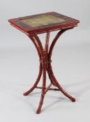 A red painted chinoiserie occasional table, with gilt painted inset top and lacquered panels, on