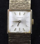 A lady`s 1960`s 9ct gold Longines manual wind wrist watch, with square dial and baton numerals, on