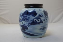 A Chinese blue and white globular jar, 18th / 19th century, painted with pavilions in a river