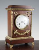 A 19th century French ormolu mounted mahogany mantel clock, with enamelled Roman dial and Marti & Co