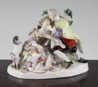 A Meissen group of a courting couple and a pug, 19th century, each seated before bocage,
