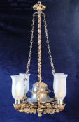 A French patinated bronze and ormolu Empire style four branch electrolier, with fancy link hanging