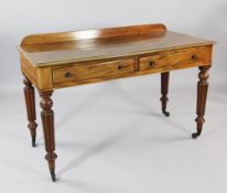 A Victorian mahogany two drawer side table, with tapering reeded legs and castor feet, W.4ft