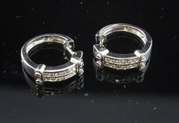 A pair of 18ct white gold and diamond set hoop earrings.