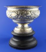 An Edwardian silver presentation rose bowl, with engraved armorial and inscription and embossed with