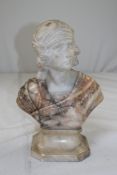 A marble and alabaster bust of a classical beauty, with floral engraving, signed G. Pinuchi, 12.