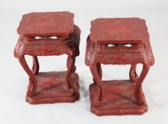 A pair of 20th century Chinese cinnabar lacquer urn stands, with shaped square tops and