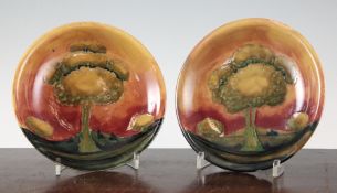 A pair of Moorcroft Eventide pattern circular dishes, c.1928, inscribed WM and impressed marks