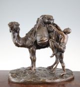 A 19th century patinated bronze model of a camel standing loaded with bags, and attendant arab