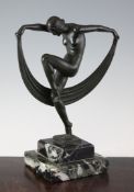 A French Art Deco patinated metal figure of a female dancer, on stepped black veined marble base,