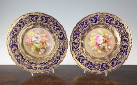 A pair of Royal Doulton flower painted cabinet plates, by Percy Curnock, c.1925, the centres with