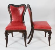 A set of six 19th century rosewood dining chairs, with shaped backs and splayed reeded supports,
