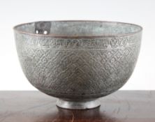 A Persian safavid tinned copper bowl, decorated with repeating flowerhead decoration, on circular