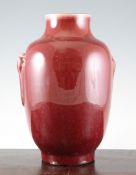 A Chinese sang de boeuf glazed vase, of ovoid form with a pair of bulbous moulded handles, 31cm.