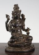A South East Asian copper bronze seated figure of a four armed bodhisattva, 15th / 16th century,