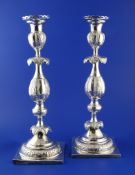 A pair of mid 19th century Russian 84 zolotnik silver Sabbath day candlesticks, maker probably M.